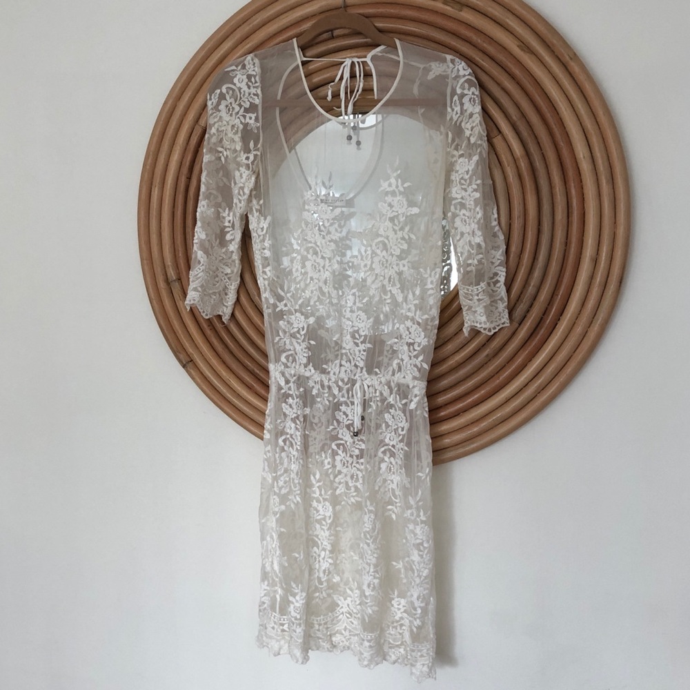 Sheer lace dress or cover up.